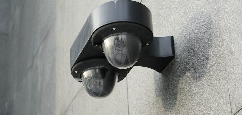 Black Motion Sensor on Gray Wall